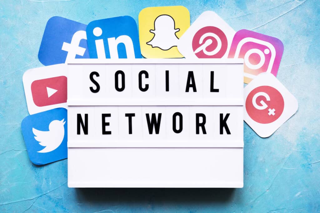 social network text with networking application icons painted wall